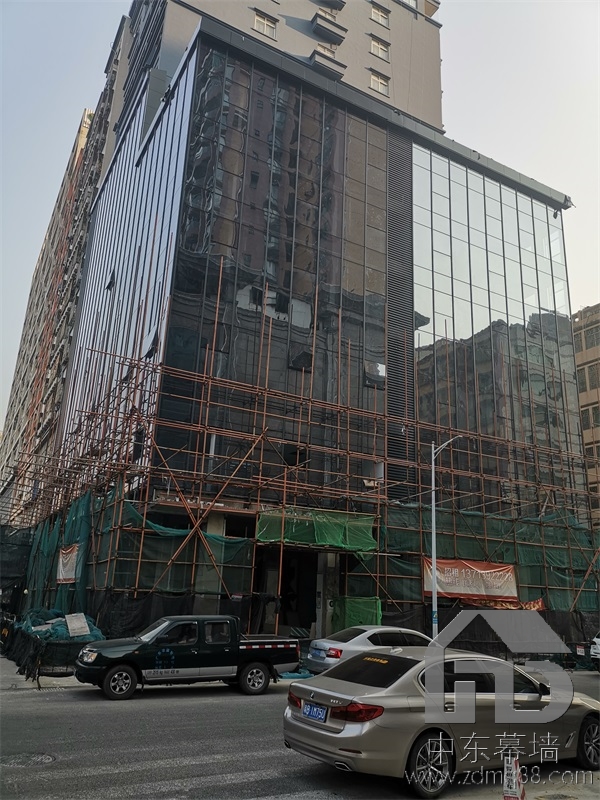 為什么現(xiàn)代建筑用玻璃幕墻？